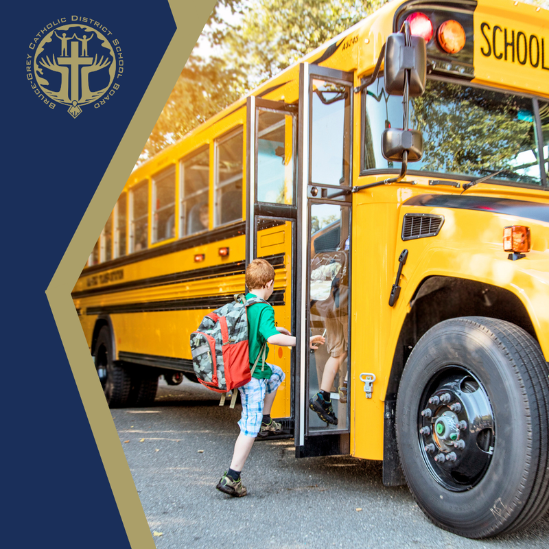 a child stepping onto a school bus