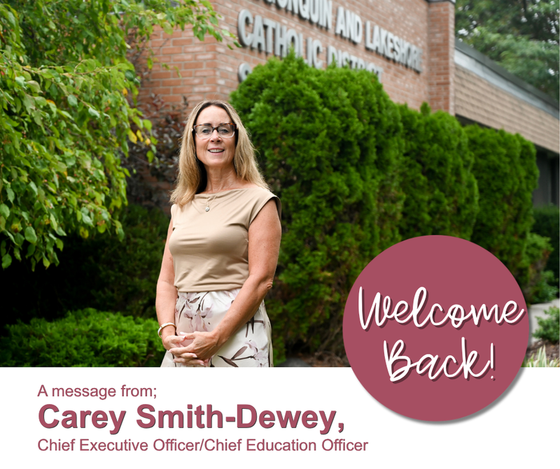 Carey Smith-Dewey standing outside with text on the image that says "welcome back"