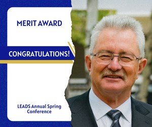 Portrait of Darrell Paproski beside a graphic reading “Merit Award – Congratulations!” recognizing the honour from the LEADS Annual Spring Conference.