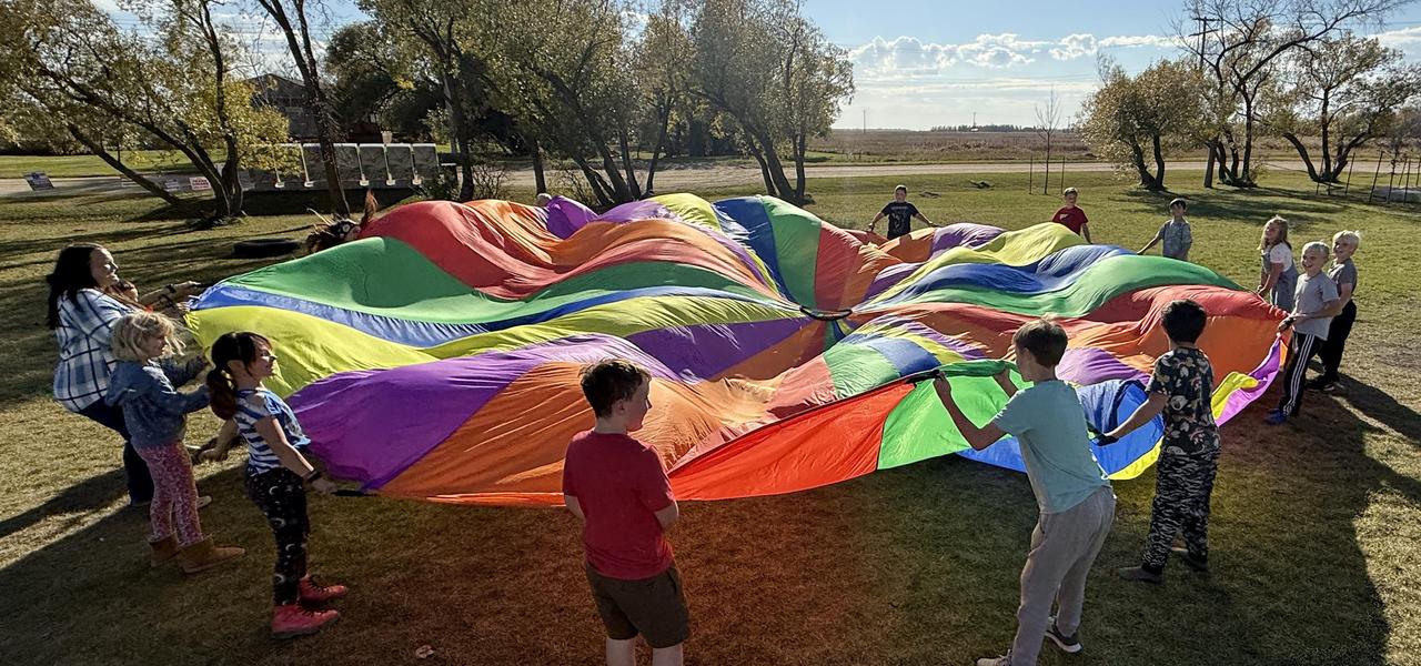 Students, parachute, bright sunny fall day