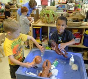 kids playing at water table