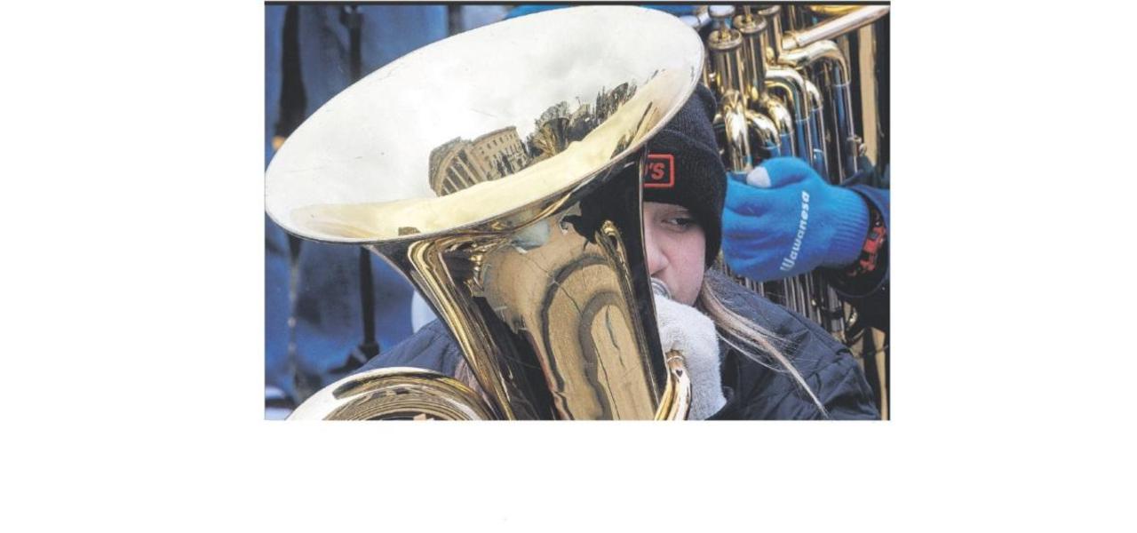 Student playing a tub.