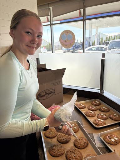 Student decorating cookies