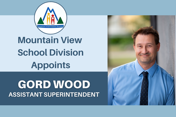 Text "MVSD Appoints Gord Wood, Assistant Superintendent" beside a professional photo of Mr. Wood leaning against a wall and trees blurred in the background.