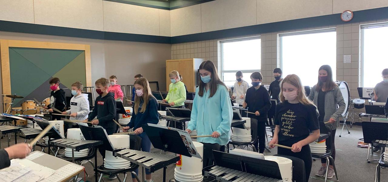 SMS Grade 6 Students bucket drumming in music class