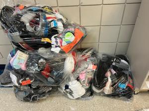 750 pairs of socks bagged and ready to be delivered to the Main Street Project.