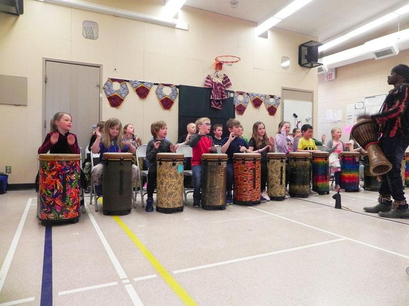 Students drumming.