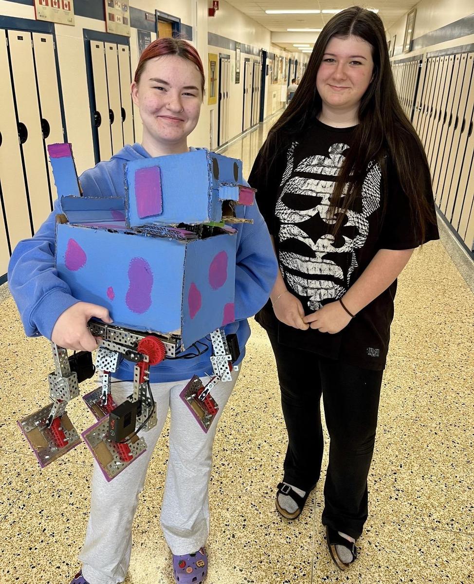 comm-tech students with their robot dog