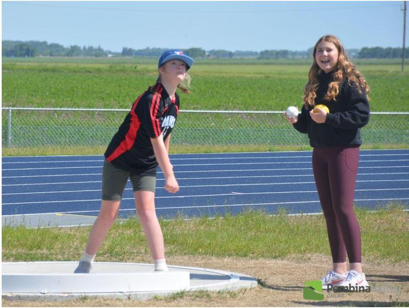 two students throwing