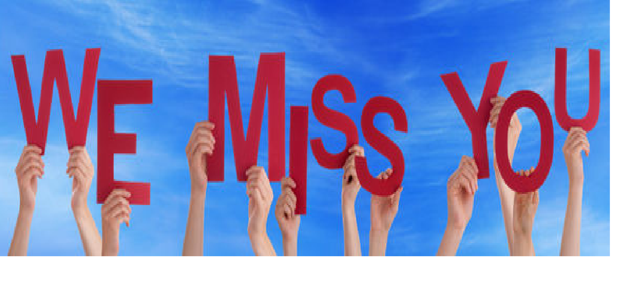 Hands holding message we miss you