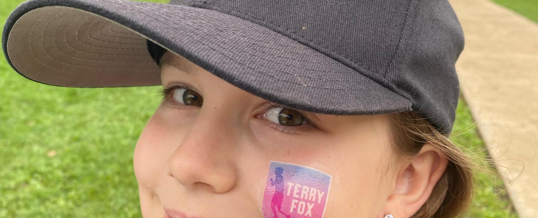 female student with Terry Fox tattoo on cheek