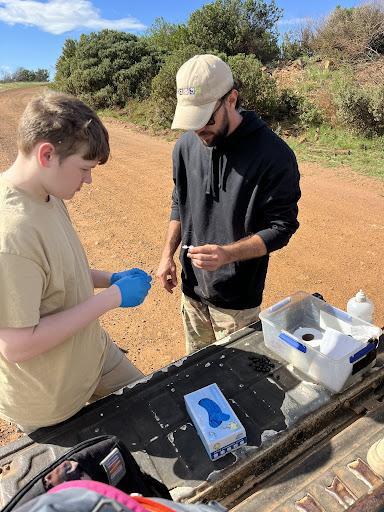 students participating in a dung survey in South Africa