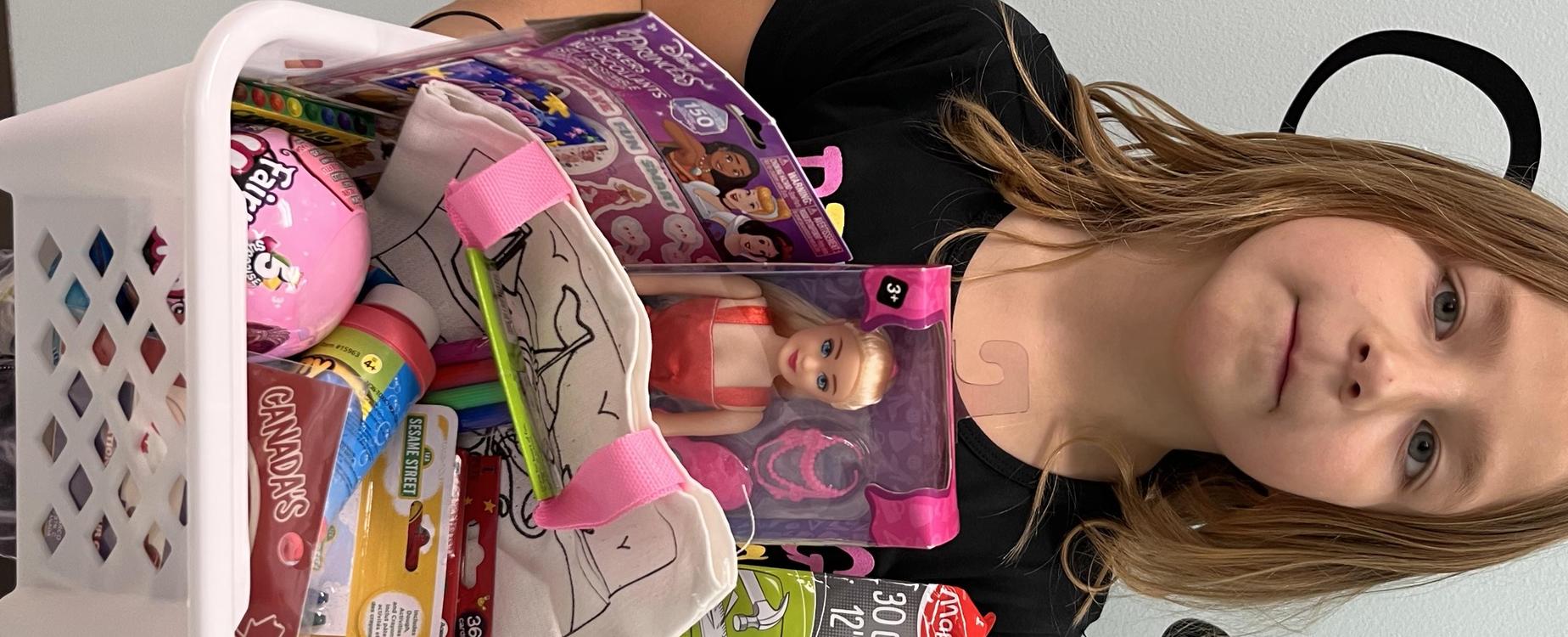 female student showing prize basket