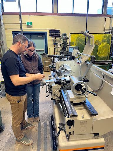 Student and teacher working on the new equipment 