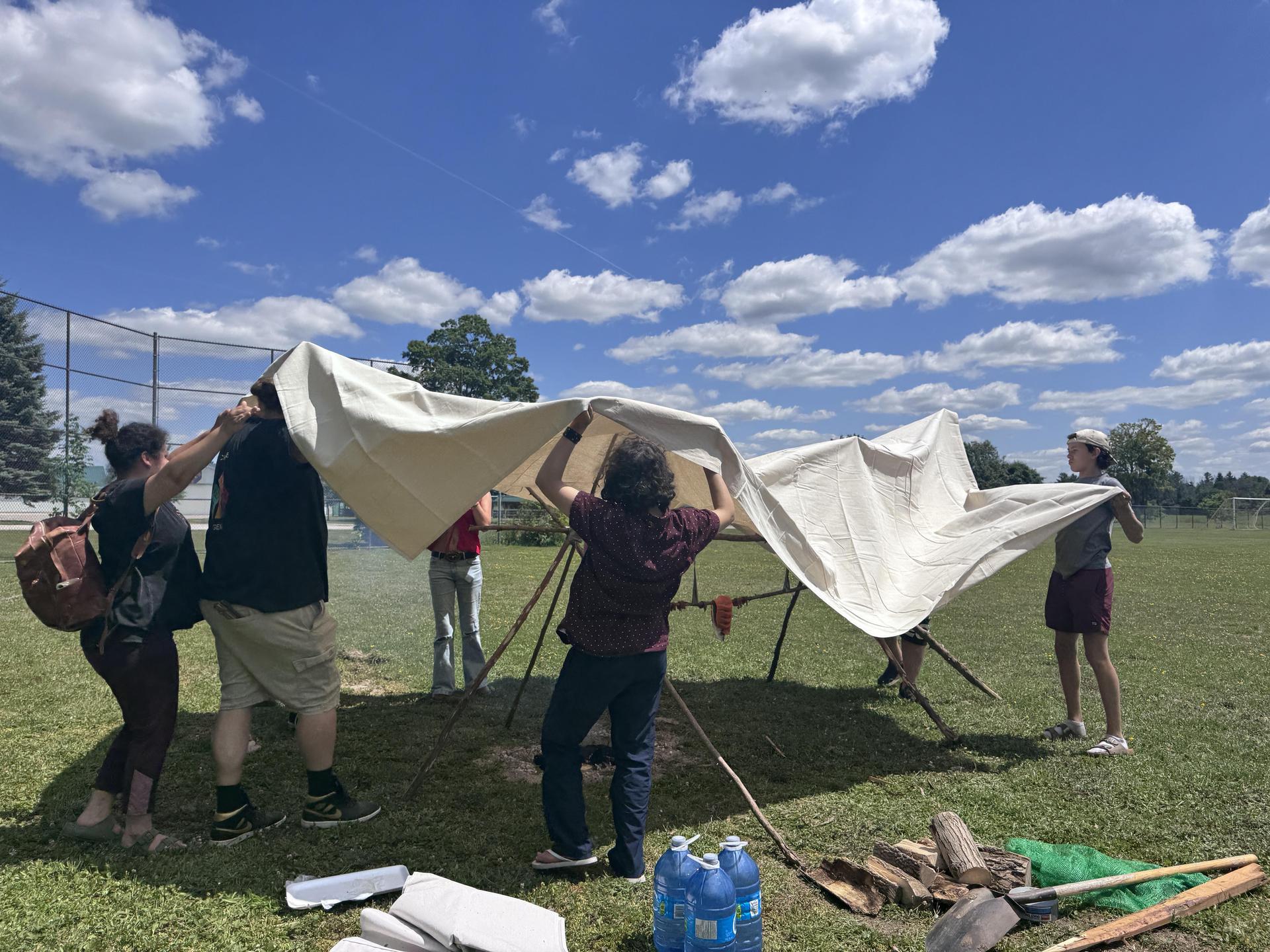 Indigenous lead Matt Baker leading students through cultural activity