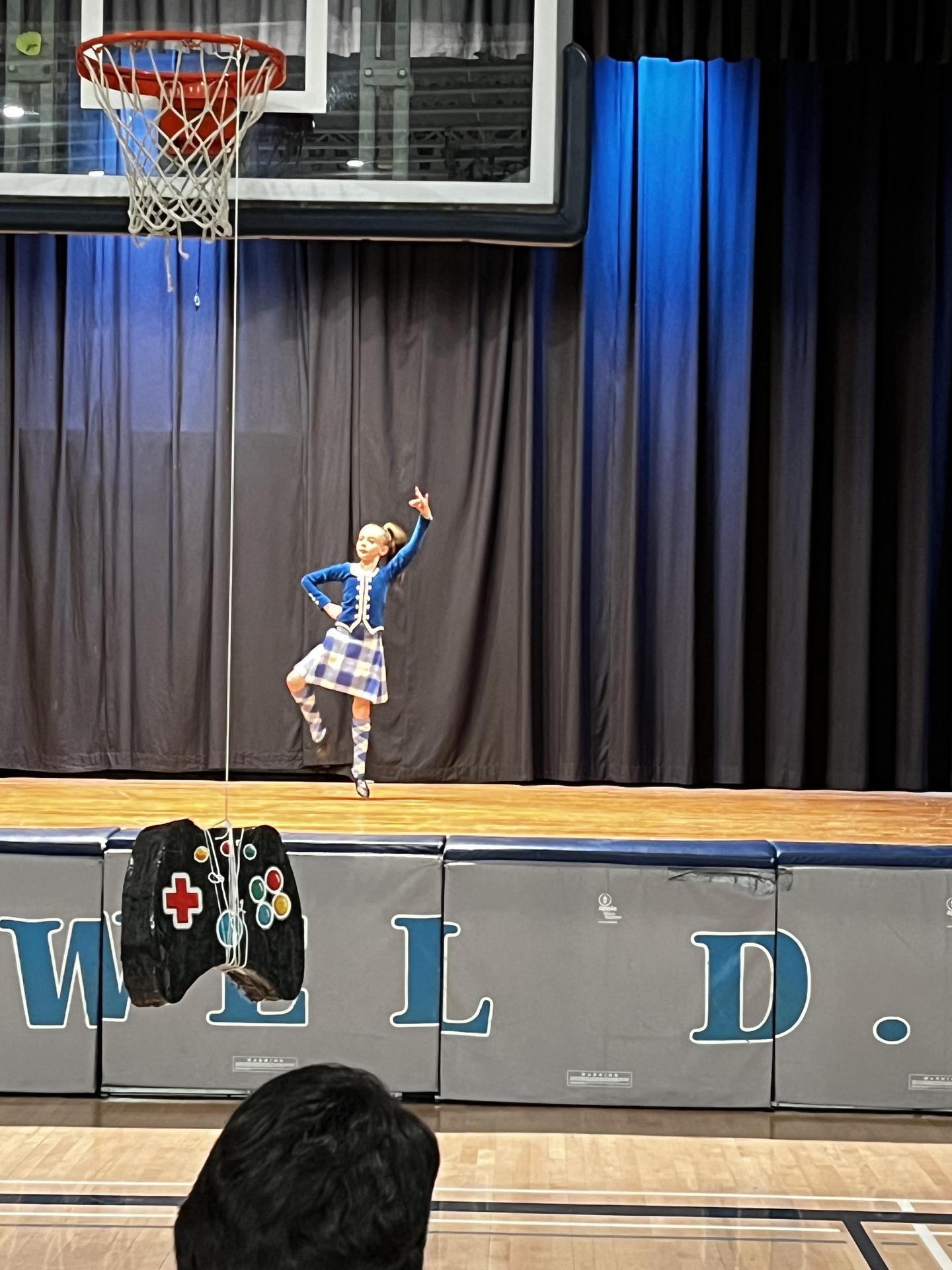 Student performing a traditional cultural dance