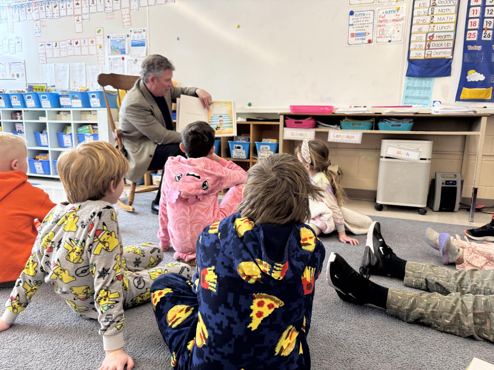Director Graham Shantz reading to a group of students