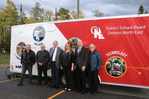 Photo of Trustees in front of the tech trailer.