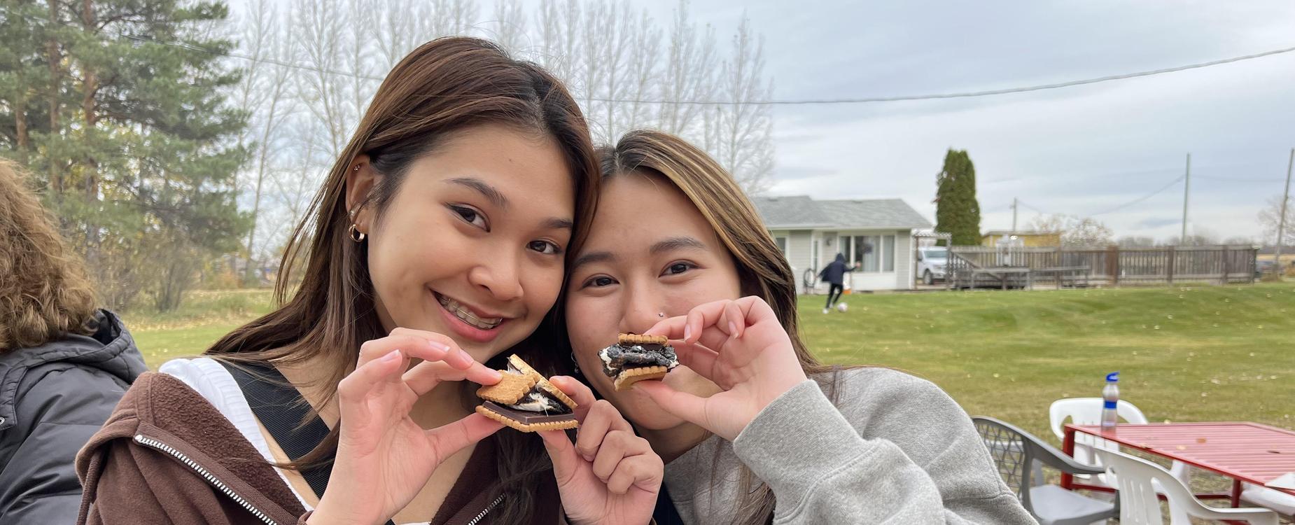 girls eating smores