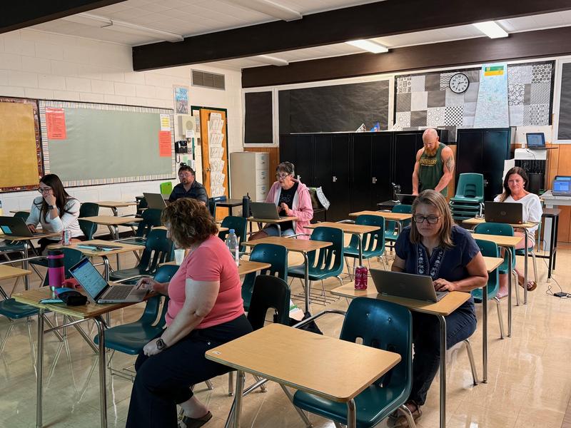 Gordon F. Kells staff learning as a team.