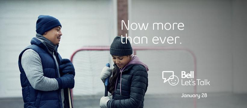Father and daughter take a break while playing hockey in front of their garage. Text: "Now more than ever". Bell Let's Talk logo