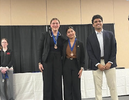 2 students presented with their medal