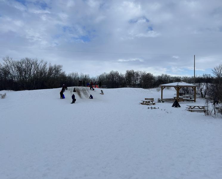 Sledding down the hill.