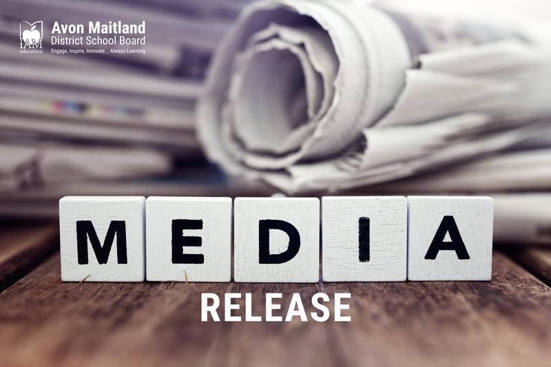 Stack of newspapers. White block letters Media Release, white AMDSB logo in top left corner