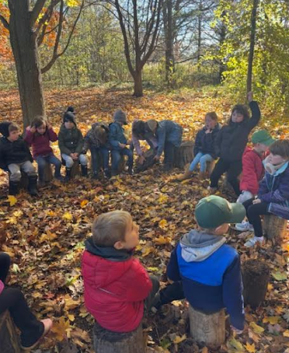Group of Elma students learning outdoors in their nature area