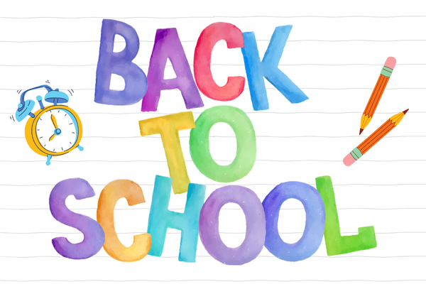 Back to school text, with an alarm clock and pencils.