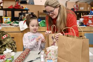 Elf Shop student and teacher