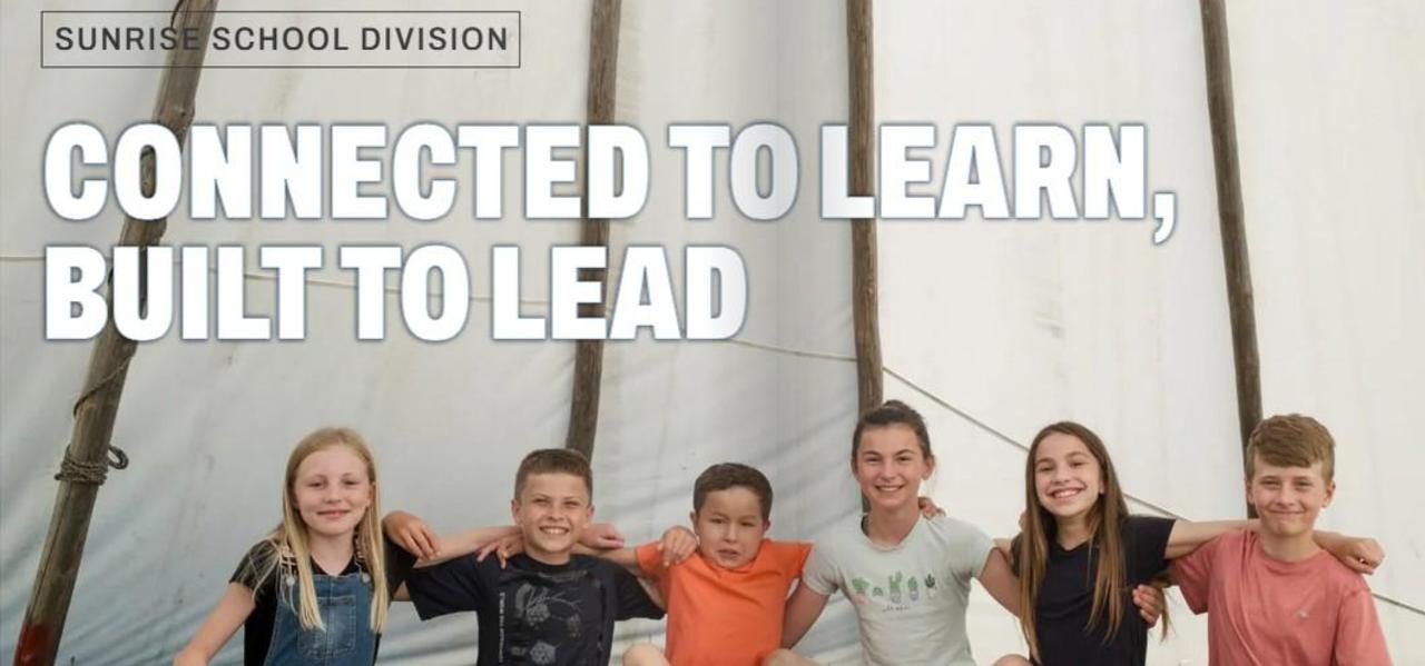 A group of 6 students arm in arm posing for a picture.  Wording reads Connected to Learn, Built to Lead.