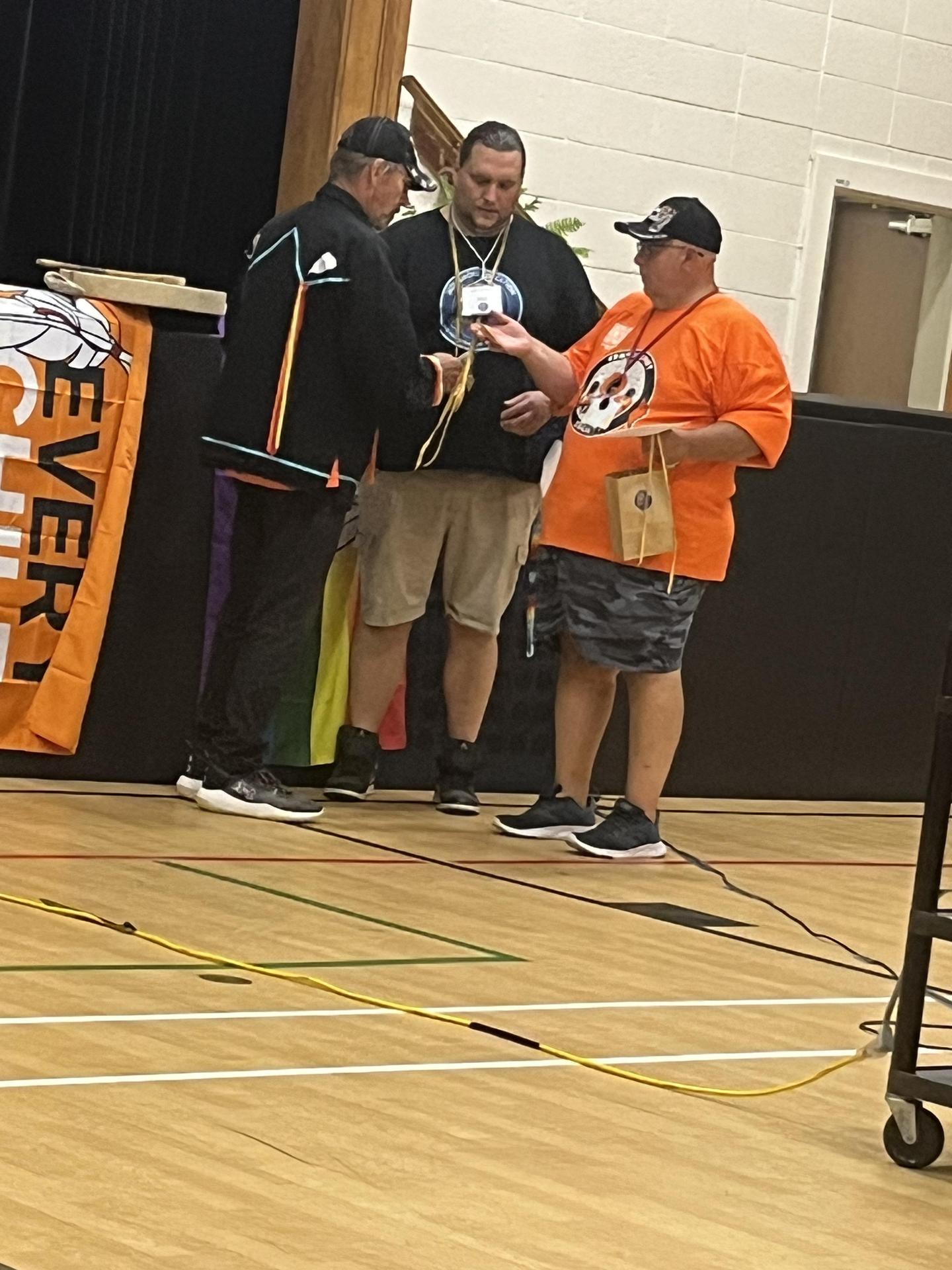 Indigenous Education Lead Matt Baker standing with Indigenous team member Jessie Dew and guest speaker