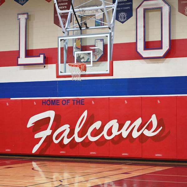 "Home of the Falcons" written in the gym.