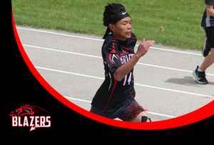 A middle school student running on a track