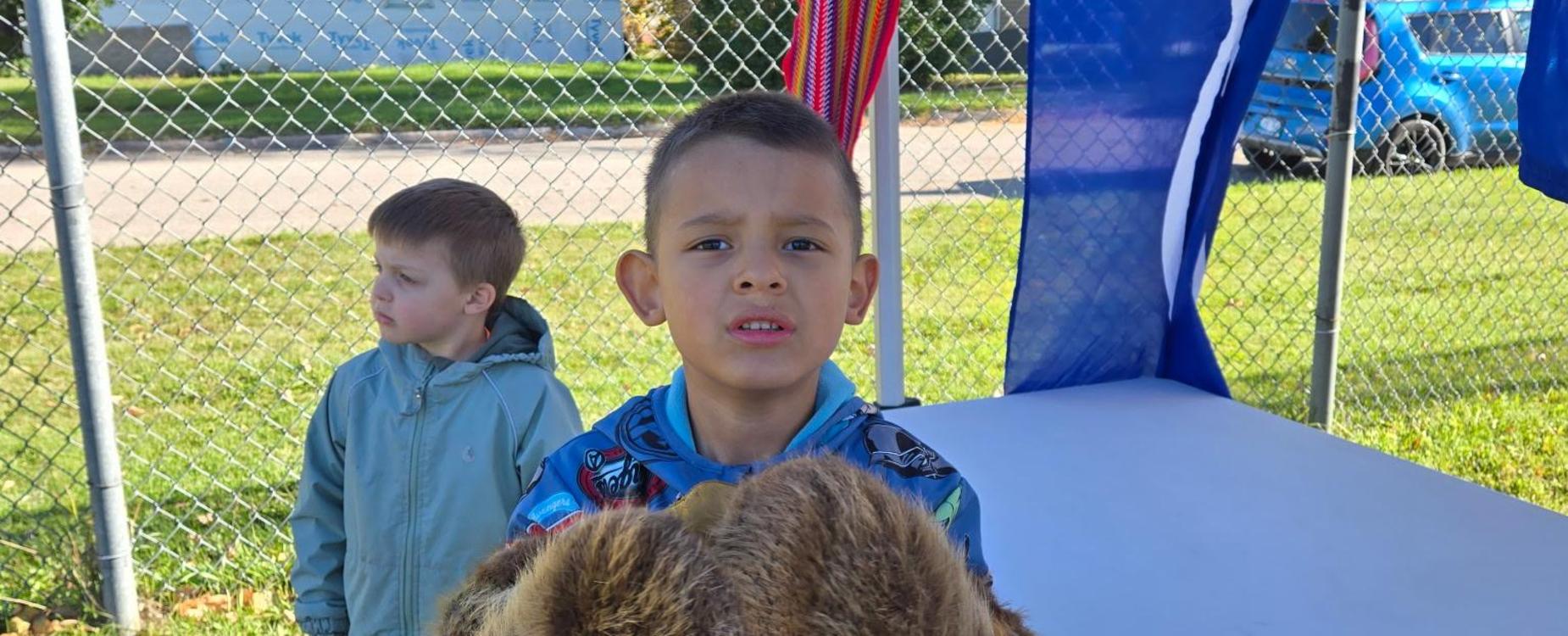 Kindergarten student showing off fur at MMS