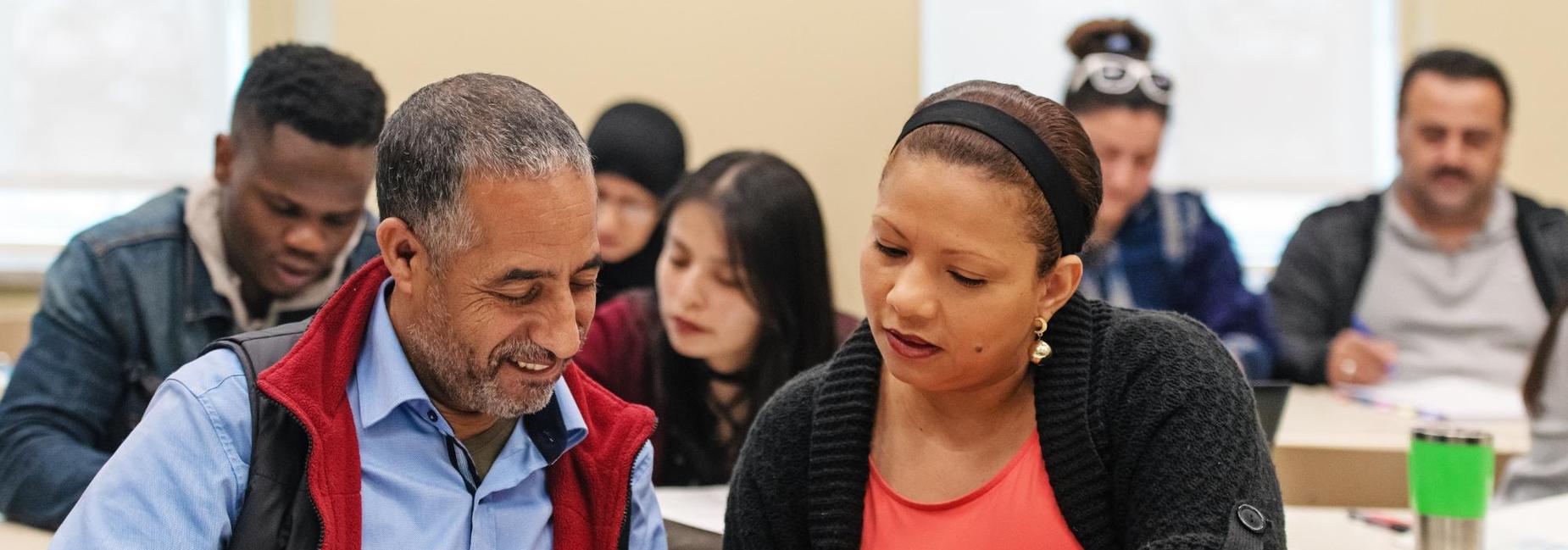 Students working on a project together in a classroom.