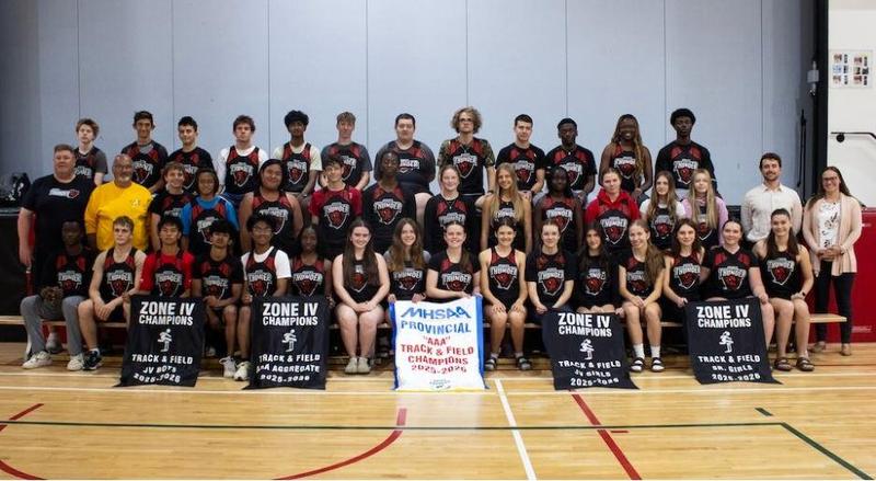track and field team posing for picture