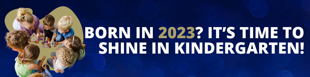 Born in 2023? It’s Time to Shine in Kindergarten! Image of students sitting on the floor with teacher