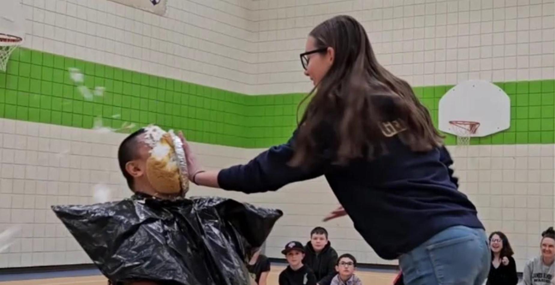 Teacher being pied in the face