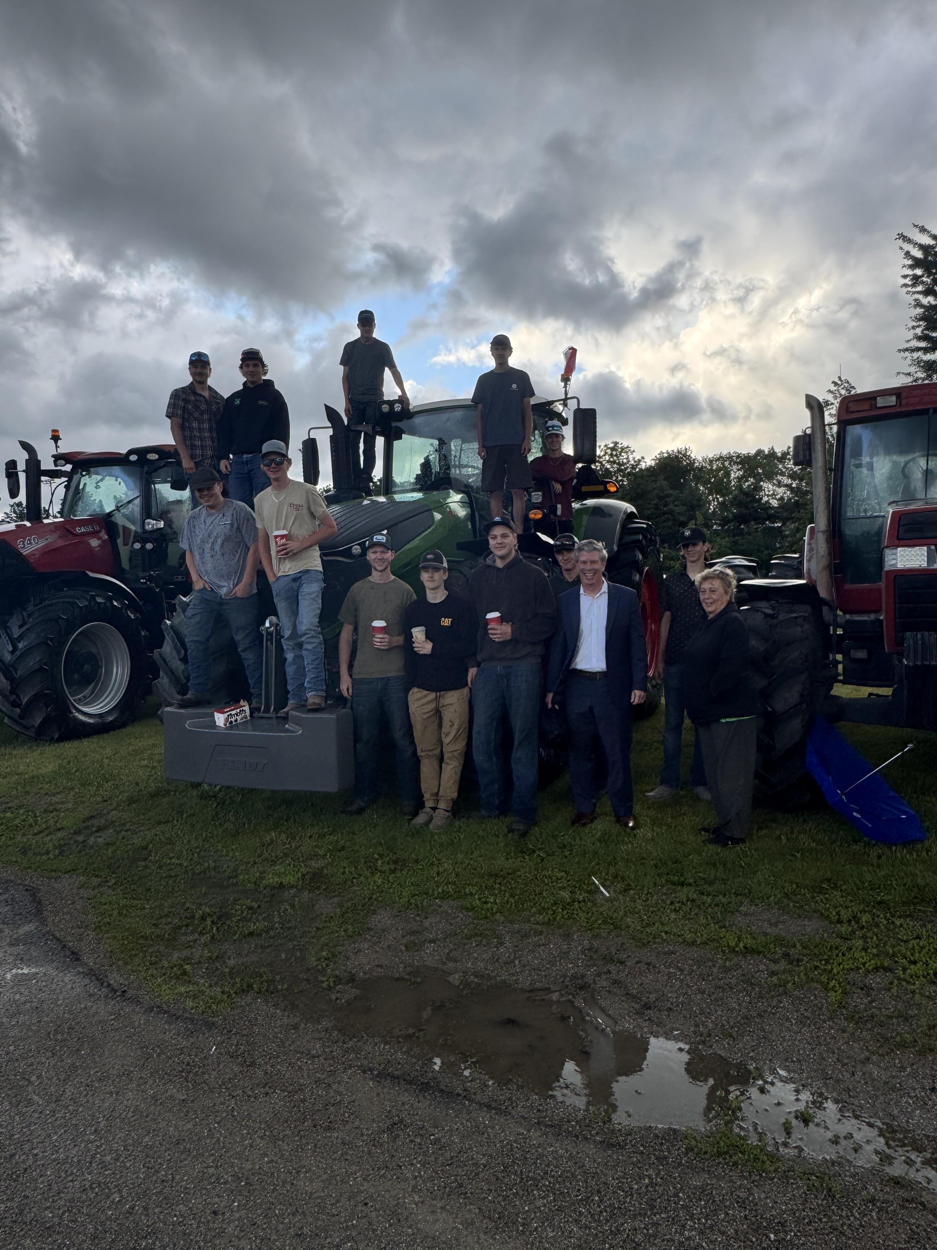Group of students standing with their tractor
