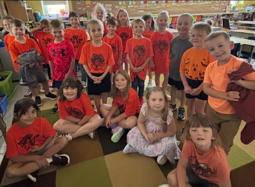 Group of Elma students wearing orange shirts