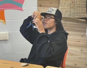 student makes moose caller