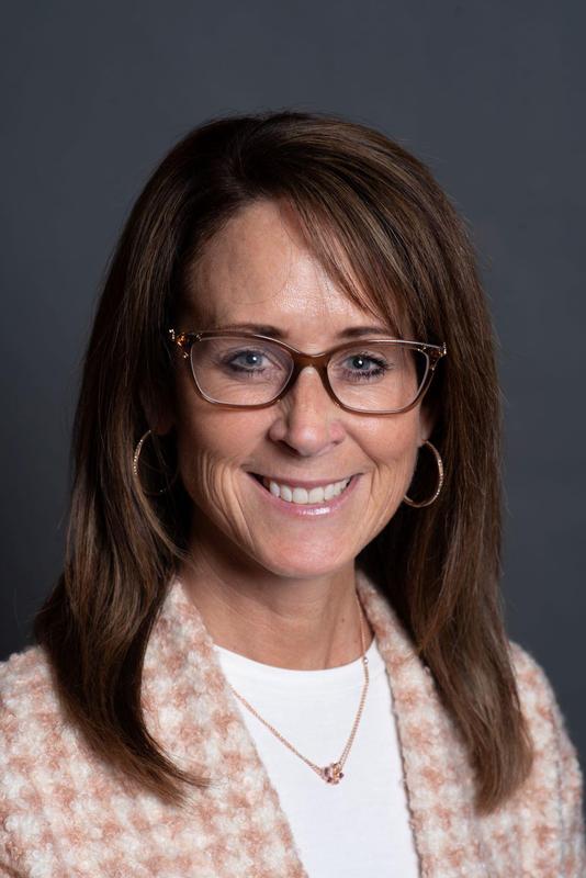 Headshot of Carey Smith-Dewey