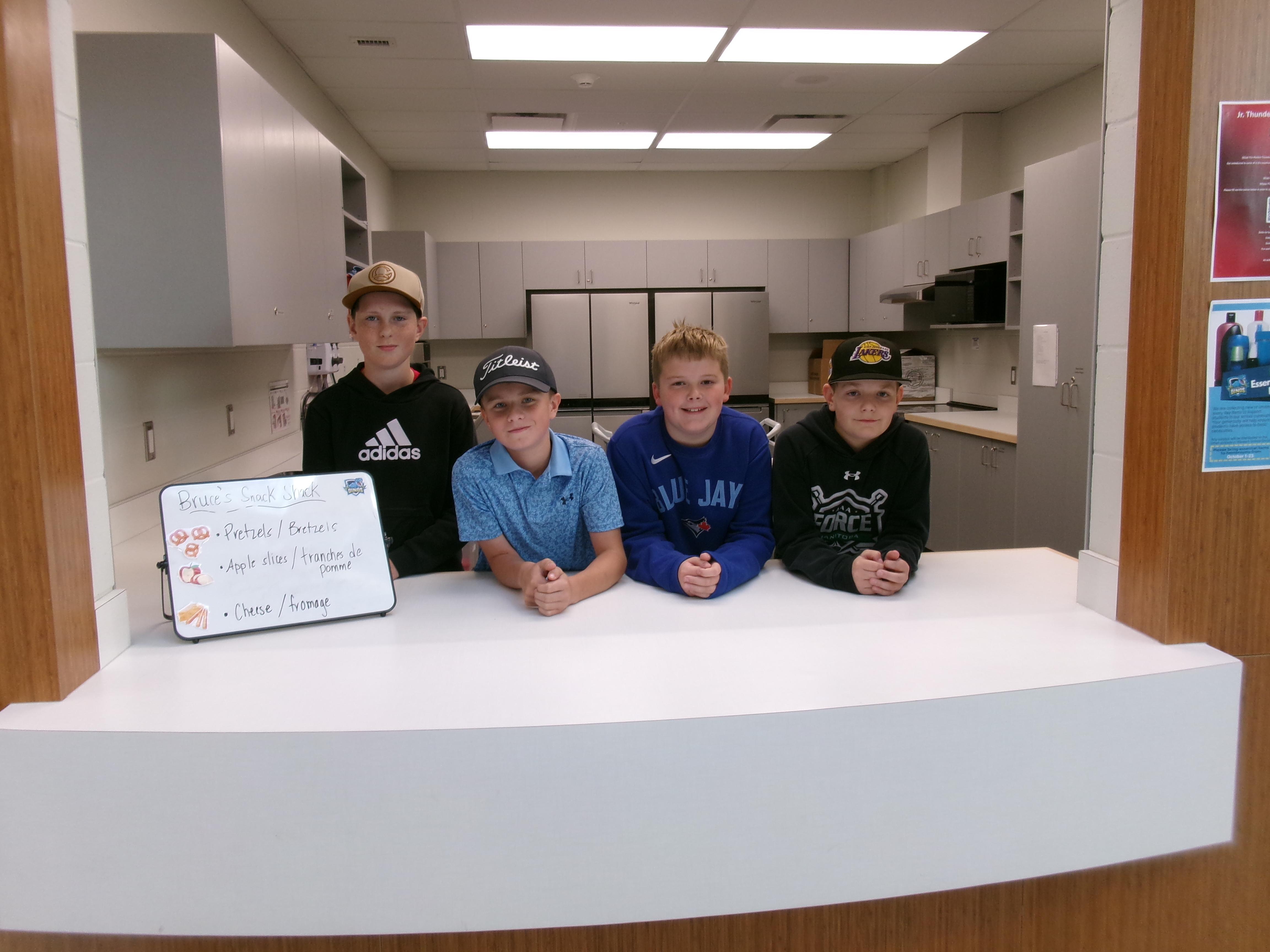 students at a canteen with a menu sign