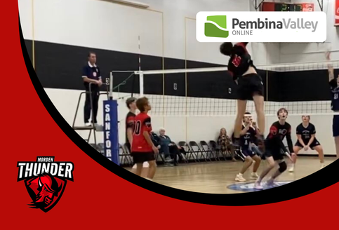 A MCI Thunder volleyball player jumps to hit a ball during a game.