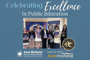A group of people stand together indoors for a "Celebrating Excellence in Public Education" event, with individuals in the center holding commemorative programs. They are positioned in front of a blue banner that reads "Excellence In". The image is framed by a blue background featuring the logos for the Avon Maitland District School Board, District 8 OSSTF, and the school logo.