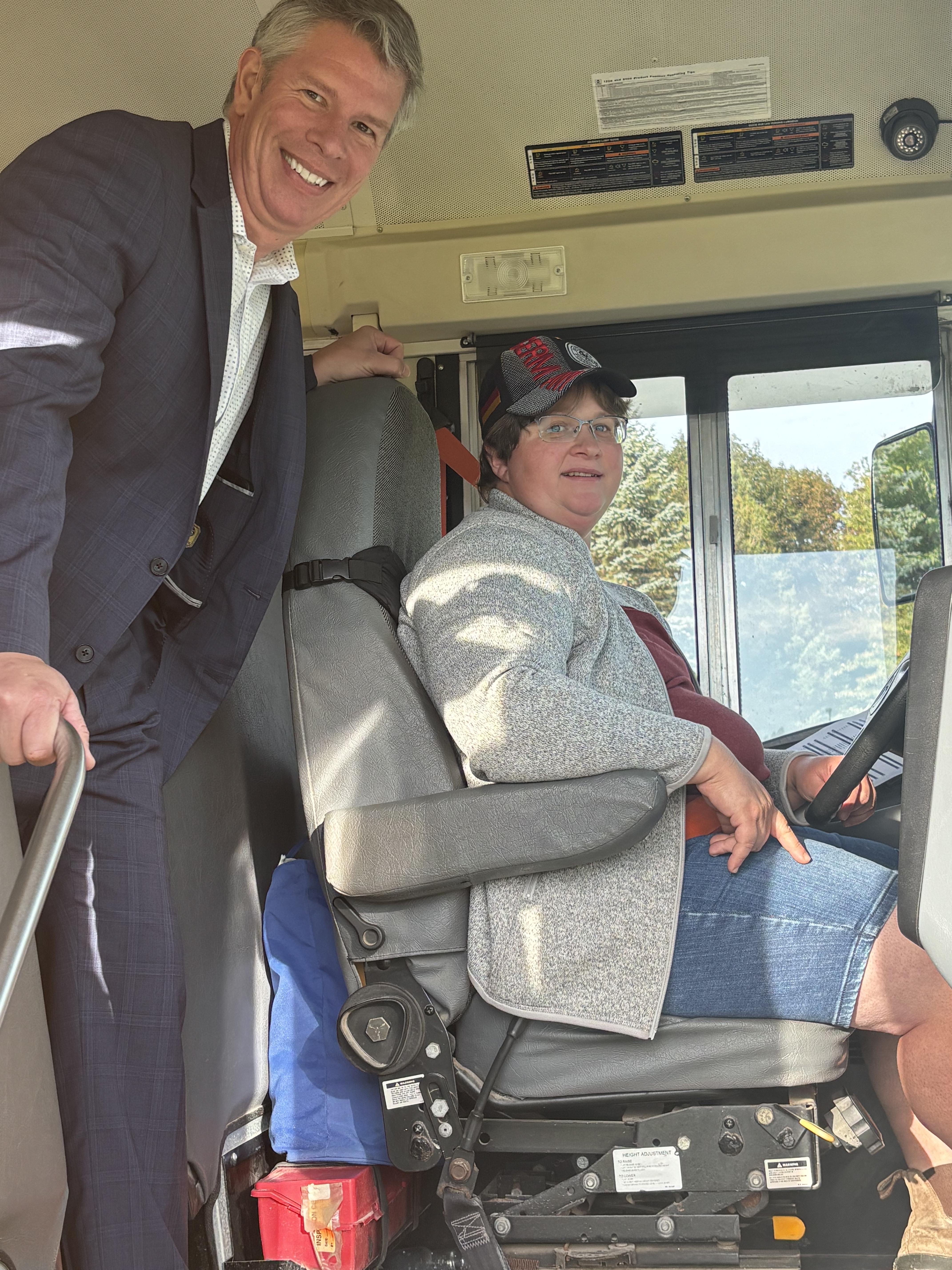 CEO Shantz posing with bus driver