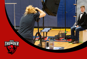 Photo of a student have their picture taken a school picture day.