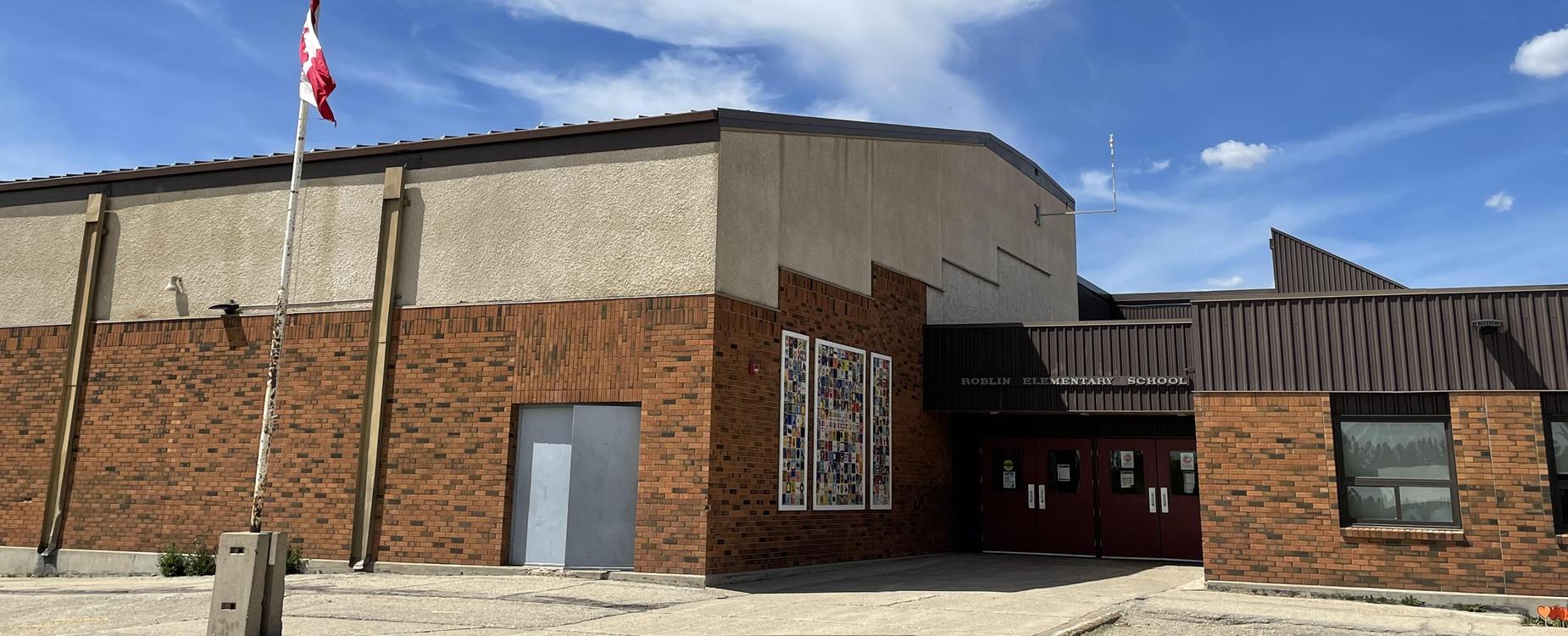 School and flag flying half mast